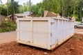 In order to recycle garbage, a metal container trash dumpster is used