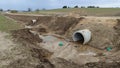 In order to preserve the gravel road between the villages when it was repaired, concrete pipes were laid under it for the flow of