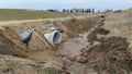 In order to preserve the gravel road between the villages when it was repaired, concrete pipes were laid under it for the flow of