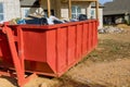 In order to recycle garbage, a metal container trash dumpster is used