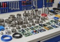 An ordered workshop setup features an array of mechanical gears and electronic components. Various Royalty Free Stock Photo