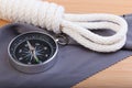 Orderliness white scout rope, compass and fabric. Royalty Free Stock Photo