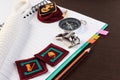 Orderliness white scout rope, compass, scouts badge and pencil o Royalty Free Stock Photo