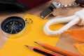 Orderliness white scout rope, scarf, whistle, compass, pencil and paper note.