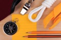Orderliness white scout rope, scarf, whistle, compass, pencil and paper note. Royalty Free Stock Photo