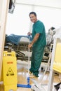 An Orderly Mopping The Floor In A Hospital Royalty Free Stock Photo