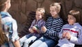 Ordinary children in the park on a bench in autumn Royalty Free Stock Photo