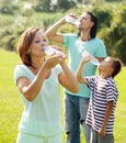 Ordinary couple with teenager drinking water Royalty Free Stock Photo