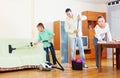 Ordinary family doing house cleaning