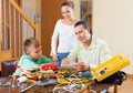 Ordinary family with working tools Royalty Free Stock Photo