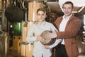 Ordinary father and son examining ethnic drums