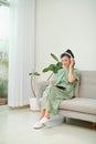 Ordinary female asian teen portrait at home sofa remote education concept
