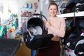 Ordinary female with car cradle for infant Royalty Free Stock Photo