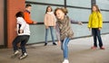 Kids playing catch in yard