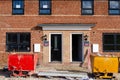 Ordinary new semi-detached house for sale and two recycling skips in front of it Royalty Free Stock Photo