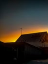 This is an ordinary Russian house at dusk. Location: Gorodets, Nizhny Novgorod region, Russia, 2020 Royalty Free Stock Photo