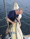 Seaman working aloft on tallship Royalty Free Stock Photo