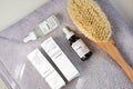 The Ordinary skincare brand by Deciem. Bottles with oil and treatments. Massage anti cellulite body brush. Spa concept