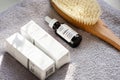 The Ordinary skincare brand by Deciem. Bottles with oil and treatments. Massage anti cellulite body brush. Spa concept