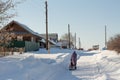 Ordinary winter village street in the Russian hinterland