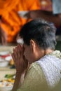 Buddhist women are paying homage to the Buddha.