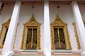 Ordination hall with golden windows of Royal temple in Nonthaburi