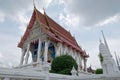 Ordination hall, or ubosot, with sweeping tiered roof at Wat Kaen Lek, a Buddhist temple in Phetchaburi, Thailand