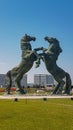 Ordos - A monument of fighting horses in Inner Mongolia, China. The horses stand on their back legs and hit one another Royalty Free Stock Photo