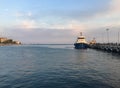 Ordu, Turkey - Sept. 13 2016: Sunset view from Unye (ÃÅnye), Ordu, Turkey, Boat in port pier, Dramatic seaside view.