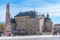 OREBRO, SWEDEN, APRIL 19, 2019: Monument of Carl XIV Johan and Orebro Slott castle in Orebro, Sweden Royalty Free Stock Photo