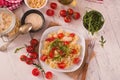 Orecchiette pasta with arugula and tomato.