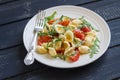 Orecchiette pasta with tomatoes, Parmesan and rocket salad Royalty Free Stock Photo