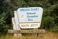 Oregon Dunes National Recreation Area South Jetty sign in natural vegetation