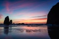 Oregon sunset between the needles and the haystack at cannon beach Royalty Free Stock Photo