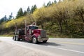 Oregon, USA - April 05, 2021: kenworth hauler truck semi trailer for transporting on highway road.