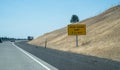 Highway interstate sign noting a truck escape ramp ahead, for runaway semi trucks going down a