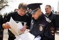 Orel, Russia - April 28, 2017: Drivers meeting. Policeman checking protester papers