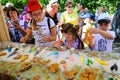 Orel, Russia - August 04, 2018: Samovar fest. Children paint homemade cookies with food coloring