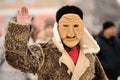 Orel, Russia, February 18, 2018: Maslenitsa carnival. Man in scary mask saluting