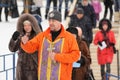 Orel, Russia - January 19, 2016: Russian epiphany feast. Orthodox priest blessing water in ice-hole Royalty Free Stock Photo