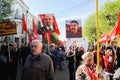 Orel, Russia, May 01, 2019: Labor Day celebration. Crowd of people marching with Stalin and Lenin portraits and red Communist Royalty Free Stock Photo