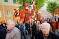 Orel, Russia, May 01, 2019: Labor Day celebration. Senior people marching with Stalin and Lenin portraits and red Communist flags Royalty Free Stock Photo