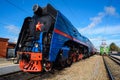 Orel, Russia, September 28, 2018: Old vintage steam Soviet locomotive P36 serries at railway station in sunny day