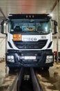 The Iveco truck tractor is undergoing maintenance at a service station