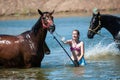 Orenburg, Russia - 18 June 2016: Girl bathing horses