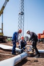 Workers on a construction site assembling a wind turbine rotor before installation Royalty Free Stock Photo