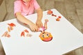 Orenburg, Russia - 01-07-2020 preschooler collects a puzzle of the structure of a person. Curious children is studying the anatomy