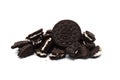 Oreo Biscuits with cracked and crumbs on white background. Pile of a sandwich cookies filled with sweet cream flavored Royalty Free Stock Photo