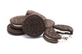 Oreo Biscuits with crumbs on white background. Pile of sandwich chocolate cookies with a sweet cream