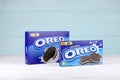 Oreo blue product box on white and light blue wooden background. Oreo is a sandwich cookie with a sweet cream is the best selling Royalty Free Stock Photo